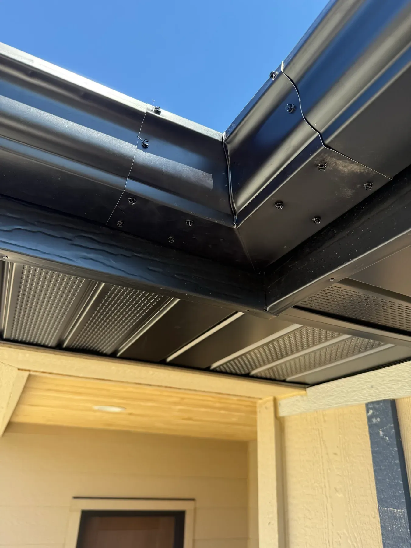 Soffit and gutter detail under a covered entry