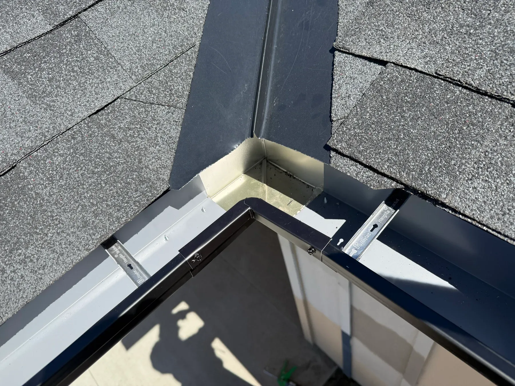 Valley gutter detail tying two rooflines together