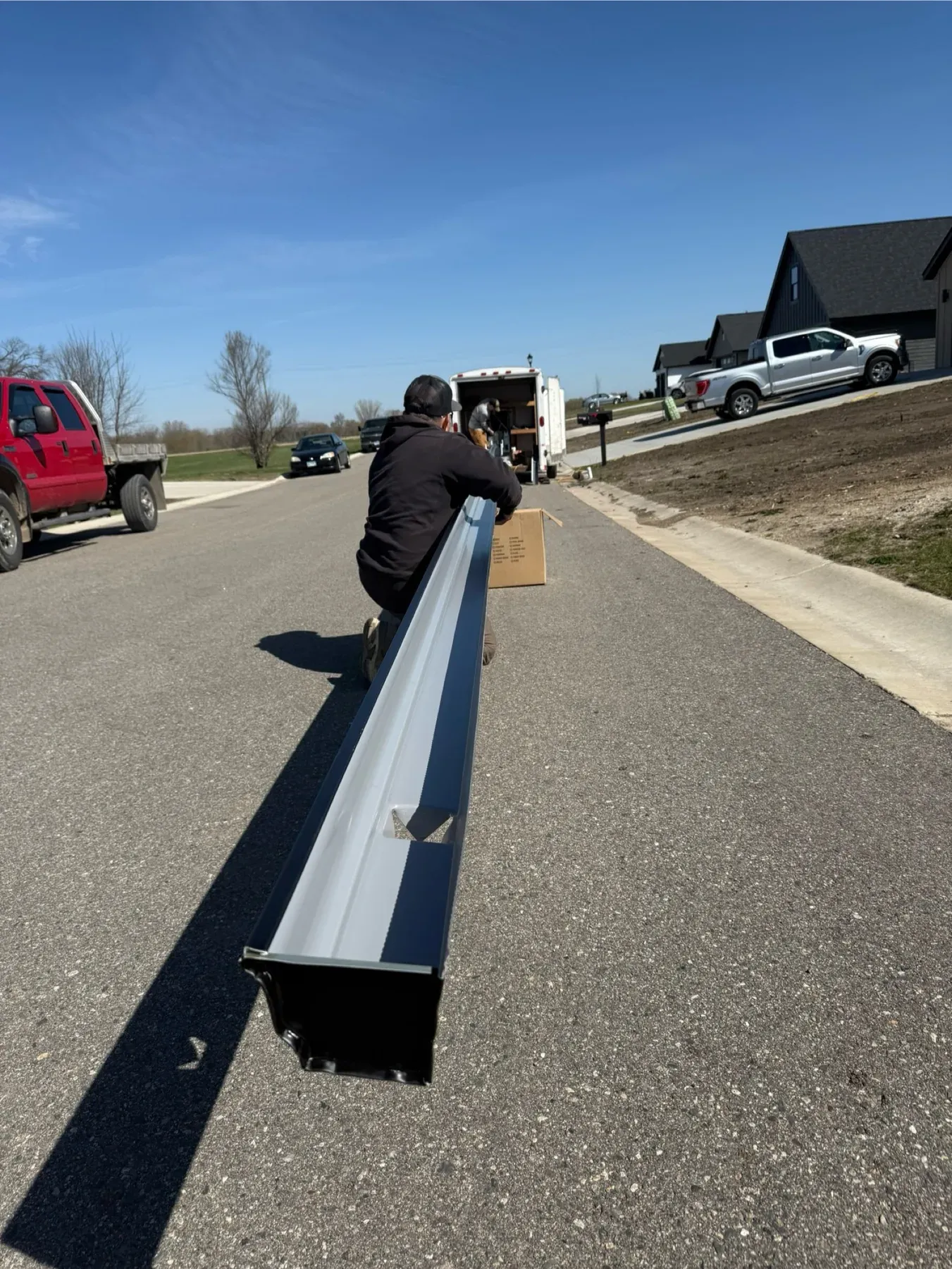 Seamless gutter formed on site beside the work truck